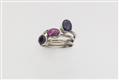 A set of three 18k gold and various coloured sapphire rings. - image-1