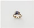 An 18k white gold star sapphire ring. - image-1