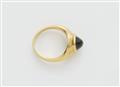 A German 21k gold and sugarloaf-cut chrysoberyl cat's eye ring. - image-2