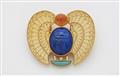 A German one of a kind 18k gold lapis lazuli carnelion and turquoise winged scarab brooch inspired by the famous amulet of Tutankhamun. - image-1