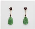 A pair of German 18k gold garrnet and carved Burmese jade earrings. - image-1