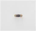 A French 18k gold diamond and sapphire eternity ring. - image-1