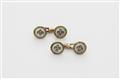 A pair of Austrian mother of pearl diamond and demantoid cufflinks. - image-1