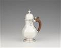 A George I silver hot milk jug - image-1