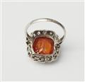 An Art Déco platinum, diamond and spessartine cluster ring. - image-2