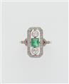 An Art Déco 14k gold platinum diamond and emerald ring. - image-1