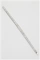 An Art Déco platinum and baguette-cut diamond tennis bracelet, ca. 1925. - image-1