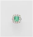 An Art Déco platinum iridium diamond and emerald cluster ring. - image-1