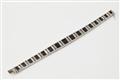 A French Art Déco 18k white gold onyx and diamond bracelet. - image-2