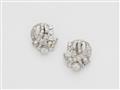 A pair of French 18k gold and diamond Art Déco earclips. - image-1