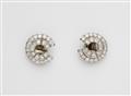 A pair of platinum and diamond swirl clip earrings with diamonds. - image-1