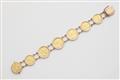 A German 14k rose gold bracelet with seven gold coins. - image-1