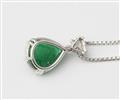 An 18k white gold triangle-cut diamond and Sandawana emerald cabochon drop pendant with attached chain. - image-2