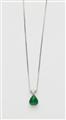 An 18k white gold triangle-cut diamond and Sandawana emerald cabochon drop pendant with attached chain. - image-1