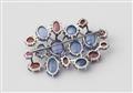 A German 18k white gold Ceylon sapphire and ruby cabochon brooch. - image-3