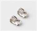 A pair of 18k white gold and diamond clip earrings. - image-2