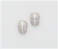 A pair of 18k white gold and diamond clip earrings. - image-1