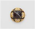 A Victorian 14k gold black enamel and pearl memory brooch with a large banded onyx cabochon. - image-1