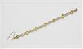 A 14k red gold platinum and peridot bracelet. - image-1