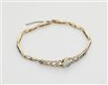 A delicate 14k gold platinum diamond and moonstone bracelet. - image-1