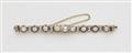 An 14k gold platinum diamond and pearl tennis bracelet. - image-1