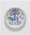 A faience dish painted in blue and yellow - image-1