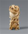 An ivory okimono of a skull with snake and frogs. Late 19th century - image-2