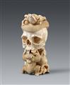 An ivory okimono of a skull with snake and frogs. Late 19th century - image-1