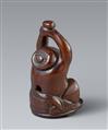 A large and unusual wood netsuke of a yawning Okame with a baby. 19th century - image-6