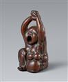 A large and unusual wood netsuke of a yawning Okame with a baby. 19th century - image-1