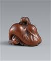 A Ise-Yamada wood netsuke of a tanuki smothering a hunter by Masakazu. Second half 19th century - image-1