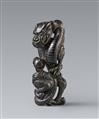 An unusual black wood netsuke of a winding dragon. 19th century - image-1