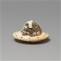 An ivory netsuke of a caparisoned shishi on a cushion. Mid-19th century - image-2