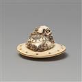 An ivory netsuke of a caparisoned shishi on a cushion. Mid-19th century - image-4