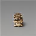 An ivory netsuke of a shishi with a ball. First half 19th century - image-2