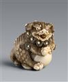 An ivory netsuke of a shishi with a ball. First half 19th century - image-1