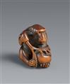 A Kyoto boxwood netsuke of a monkey with a peach by Mitsuhide. Early 19th century - image-1