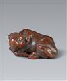 An Ise small wood netsuke of an ox by Masanao. 19th century - image-1