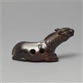 A large probably kaki wood netsuke of a recumbent stallion. 19th century - image-2