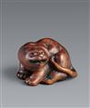 A wood netsuke of a crouching tiger. 19th century - image-1