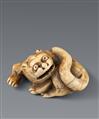 An ivory netsuke of a reclining tiger. Early 19th century - image-1