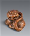 A Tsu boxwood netsuke of a howling tiger in the manner of Minko. Early 19th century - image-1