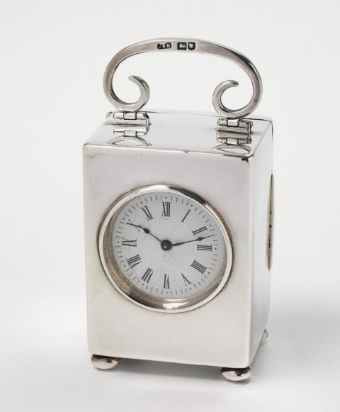 John Rees Harris - An Edward VII London silver travel clock. Marks of Josiah Rees Harris, 1905.