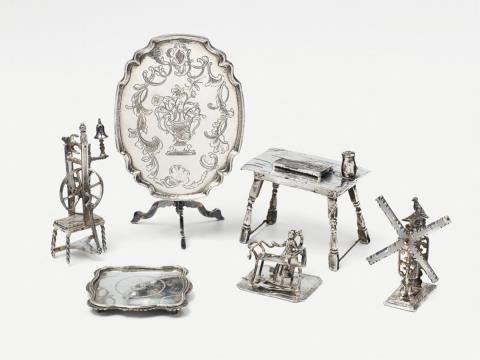 Jan Rooseboom - Six silver miniatures. Comprising a table, spinning wheel, thread spool, a table with a zither, board game and weaver. Mainly Amsterdam, 18th C. and later. The table with maker's mark Jan Rooseboom, Amsterdam 1761.