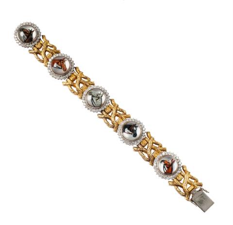 Theodor Heiden - An 18k yellow and white gold equestrian bracelet with quartz intaglios.