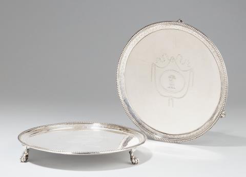 Richard Rugg - A pair of George III London silver salvers. Engraved with crests to the centres. Marks of Richard Rugg, 1817.