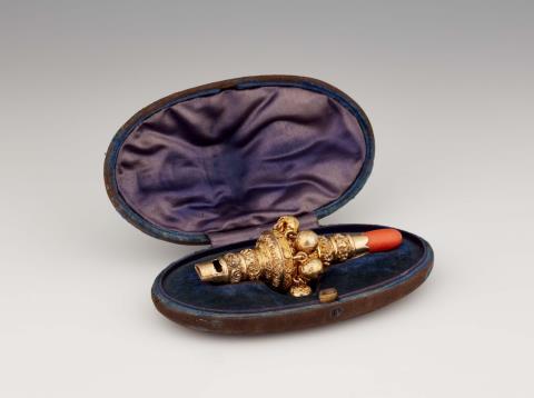 Charles Rawlings - A George IV silver gilt child's rattle in the original case