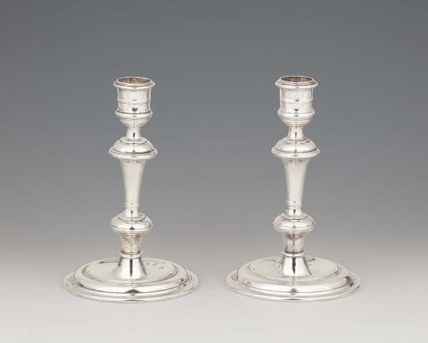 John Hamilton - A pair of George II Dublin silver candlesticks