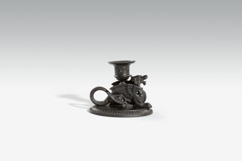 Lauchhammer - A cast iron chamberstick with a winged griffon