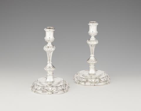Paul Crespin - A pair of George I silver candlesticks